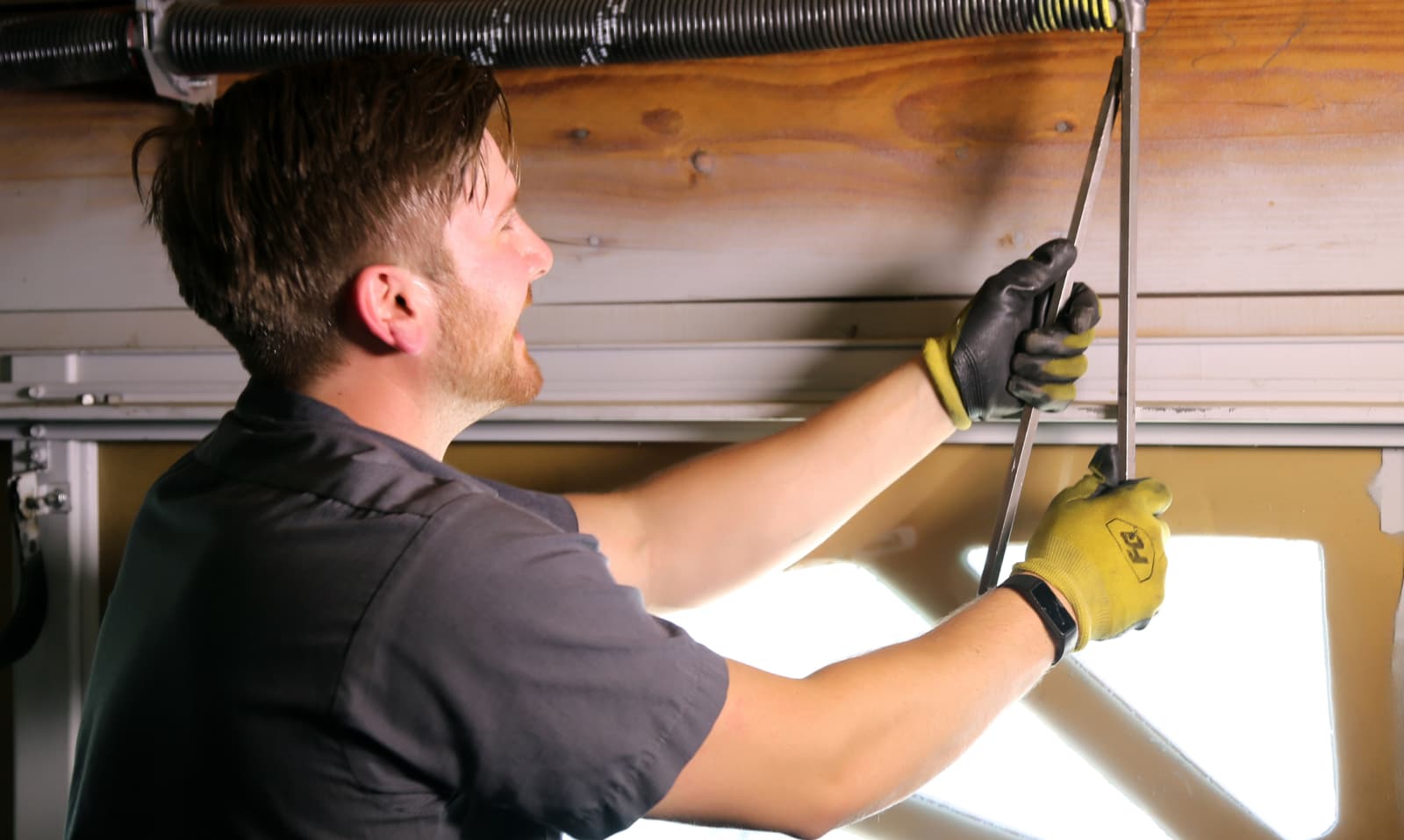 man fixing spring