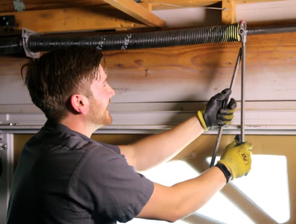 man fixing spring