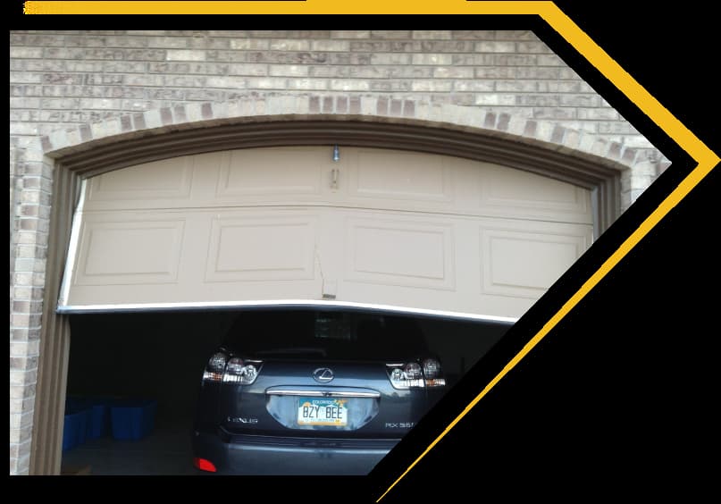 Man working on garage door spring.